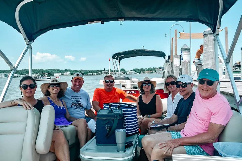 Family enjoying a pontoon boat rental in Rehoboth at dewey beach watersports