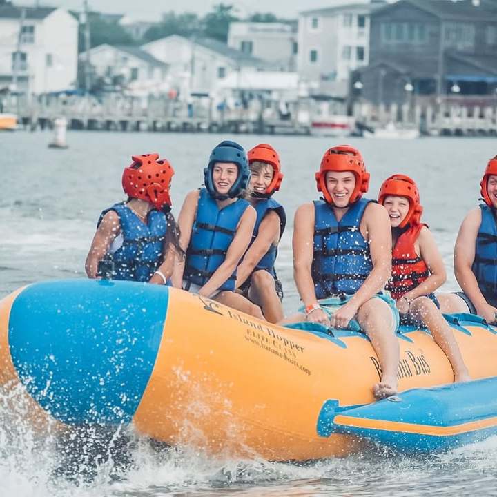Group riding banana boat on Rehoboth Bay