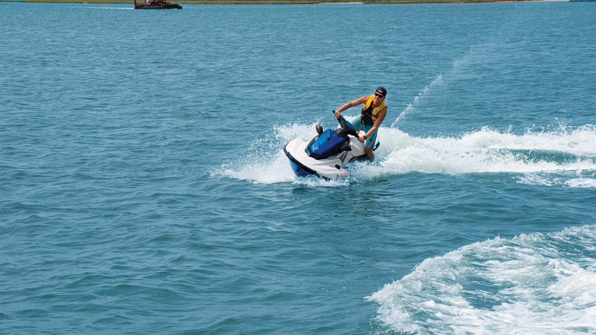 a man riding a wave on top of a body of water