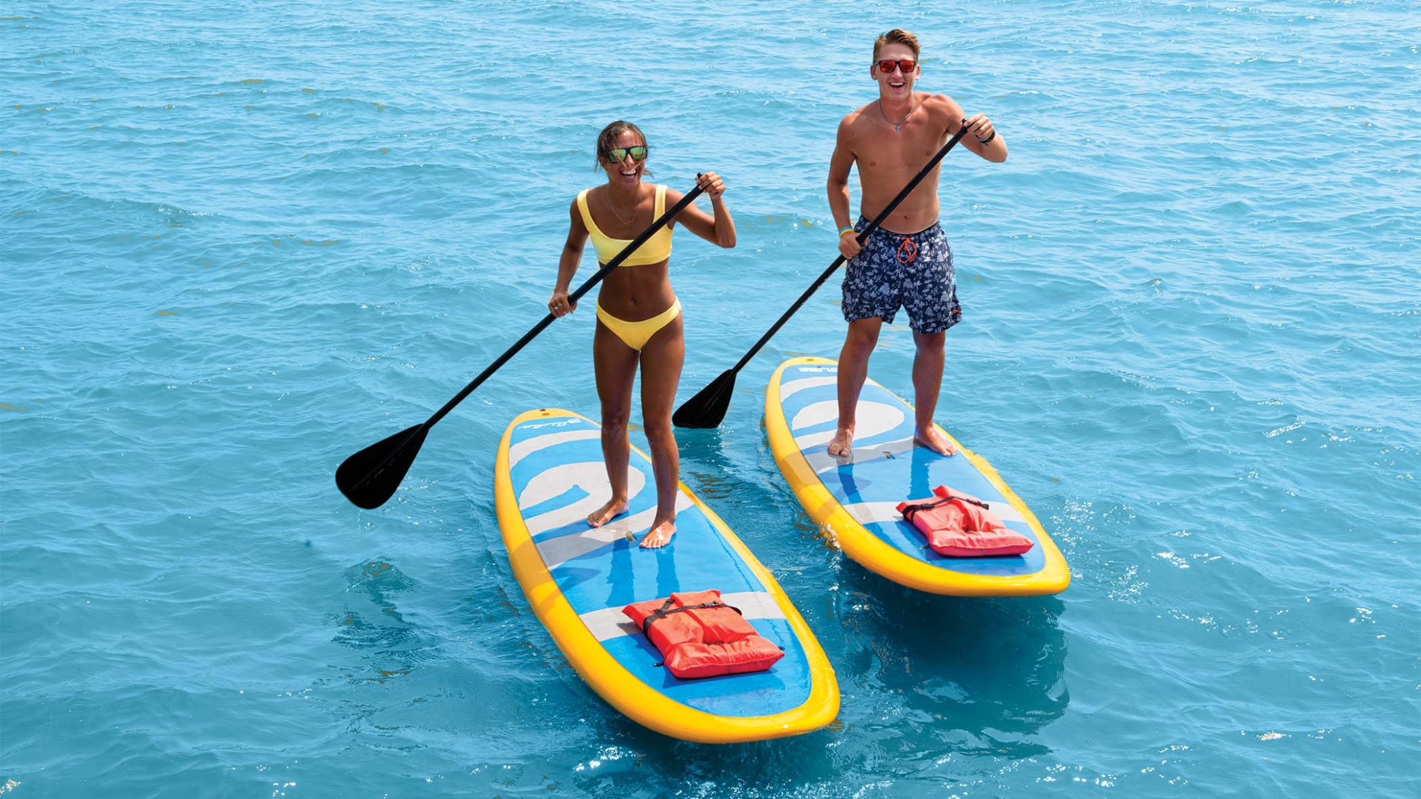 a group of people swimming in a body of water