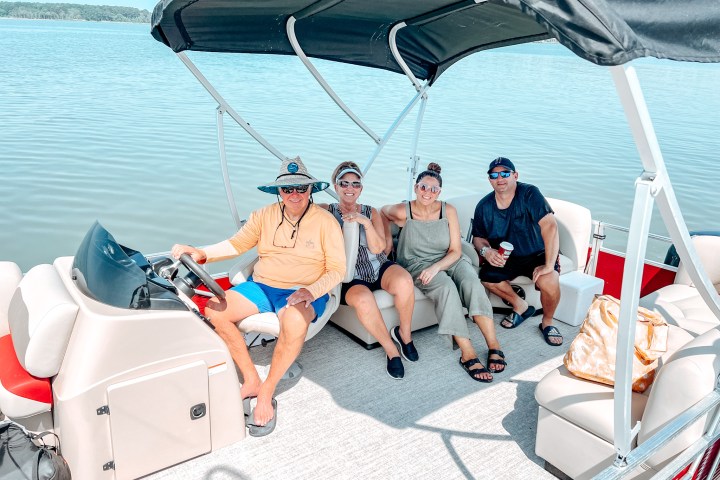 Family on a pontoon boat rental at dewey beach watersports